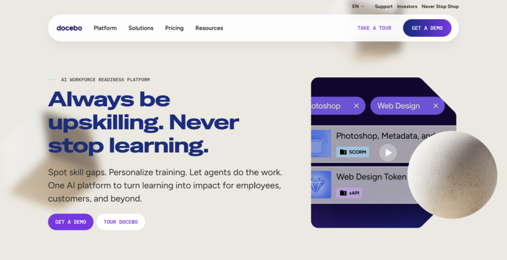 Docebo homepage banner: 'Always be upskilling. Never stop learning,' with SCORM course cards for Photoshop and Web Design tags