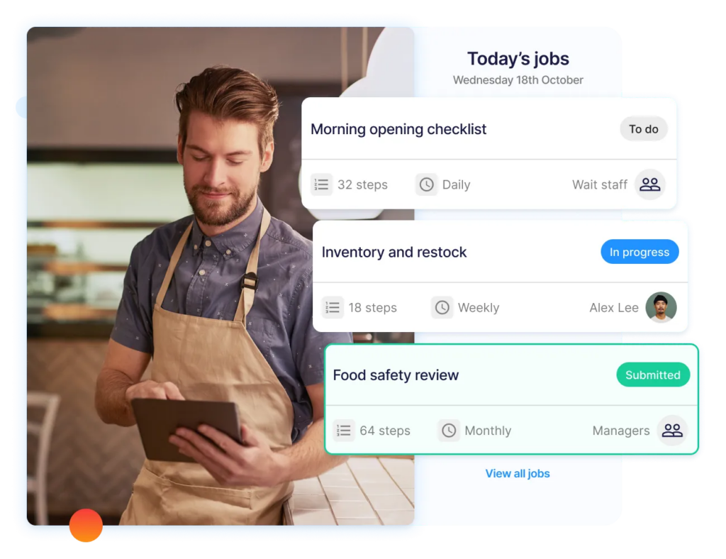 Restaurant employee using a tablet to complete digital food safety training, checklists, and compliance tasks.