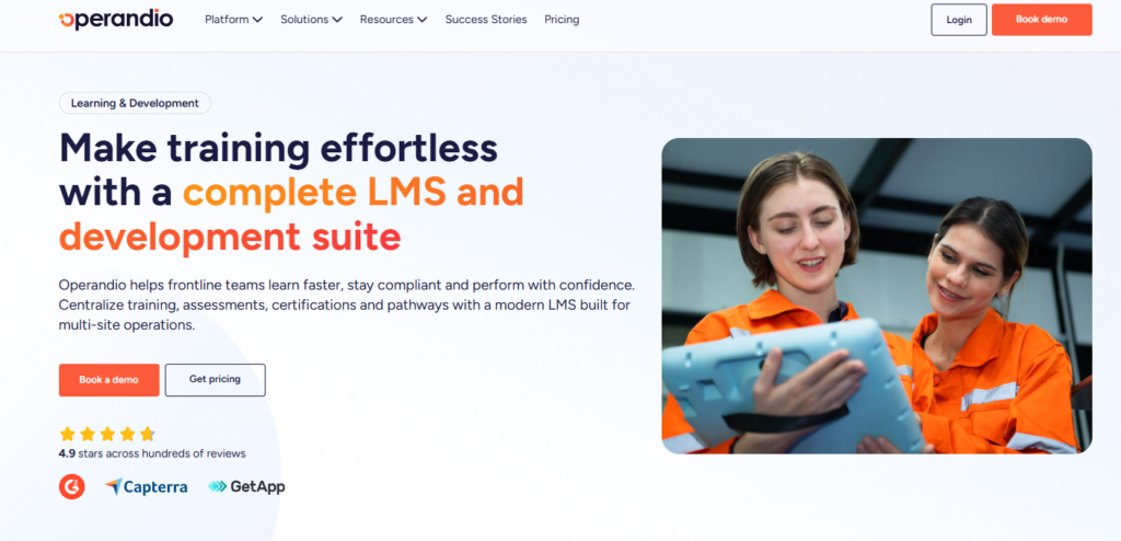 Operandio homepage banner: 'Make training effortless with a complete LMS,' with two frontline workers in orange uniforms using a tablet.
